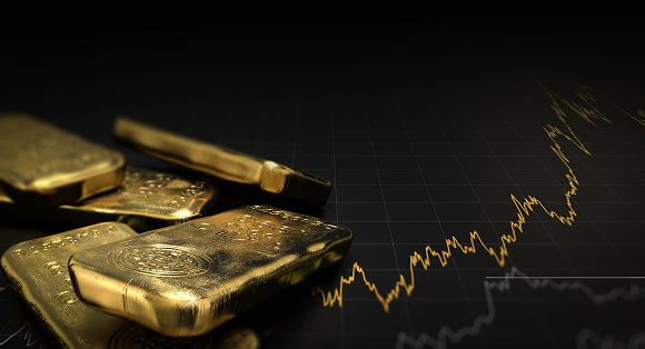 Gold bars and stock charts