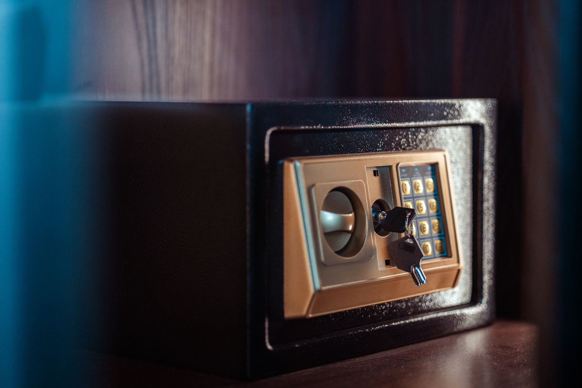 A locked safe with a gold front.