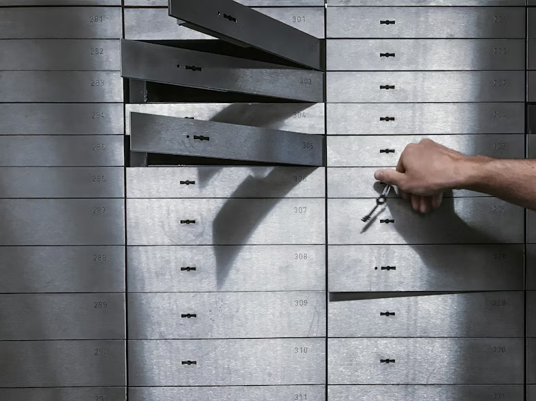 A metal locker with many storage boxes