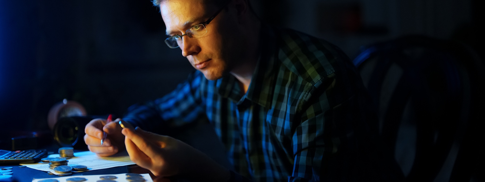 coin dealer inspecting rare coins