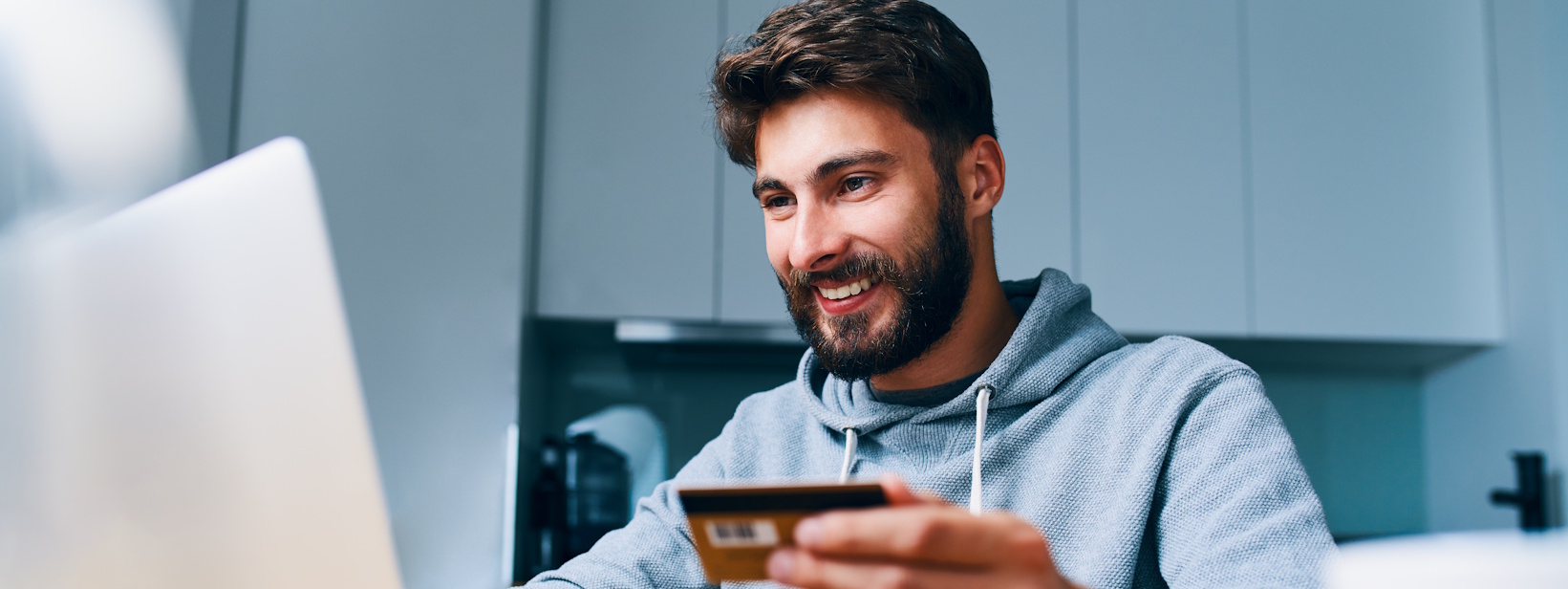 man shopping for coins online