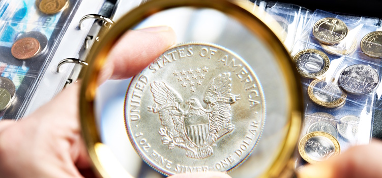 coin dealer inspecting coin