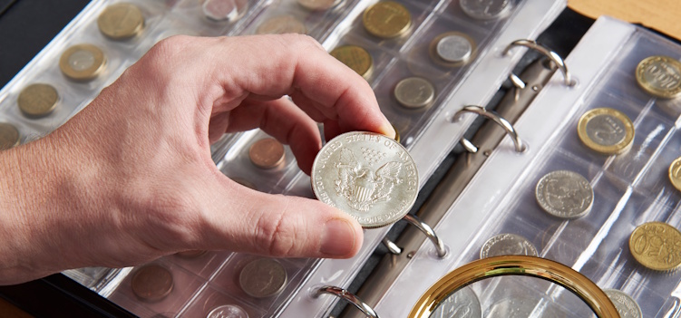 coin dealer inspecting rare coin blog header
