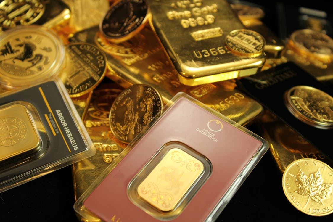gold bars and coins in a collection